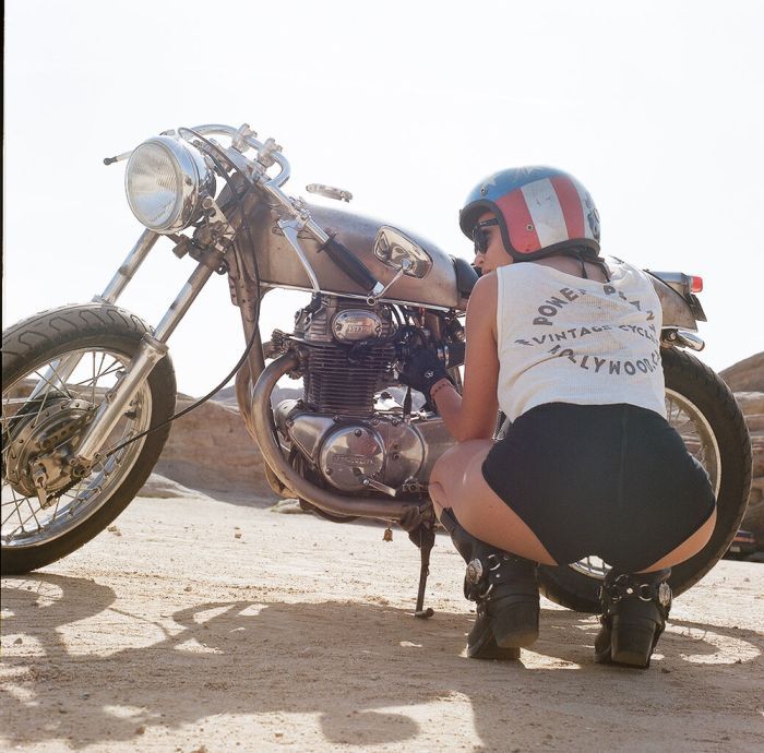 A playful frame from Girls on a motorcycle — online in Nanjing